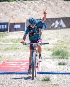 Mountain Games Athlete Haley Dumke rides her bike during a race.