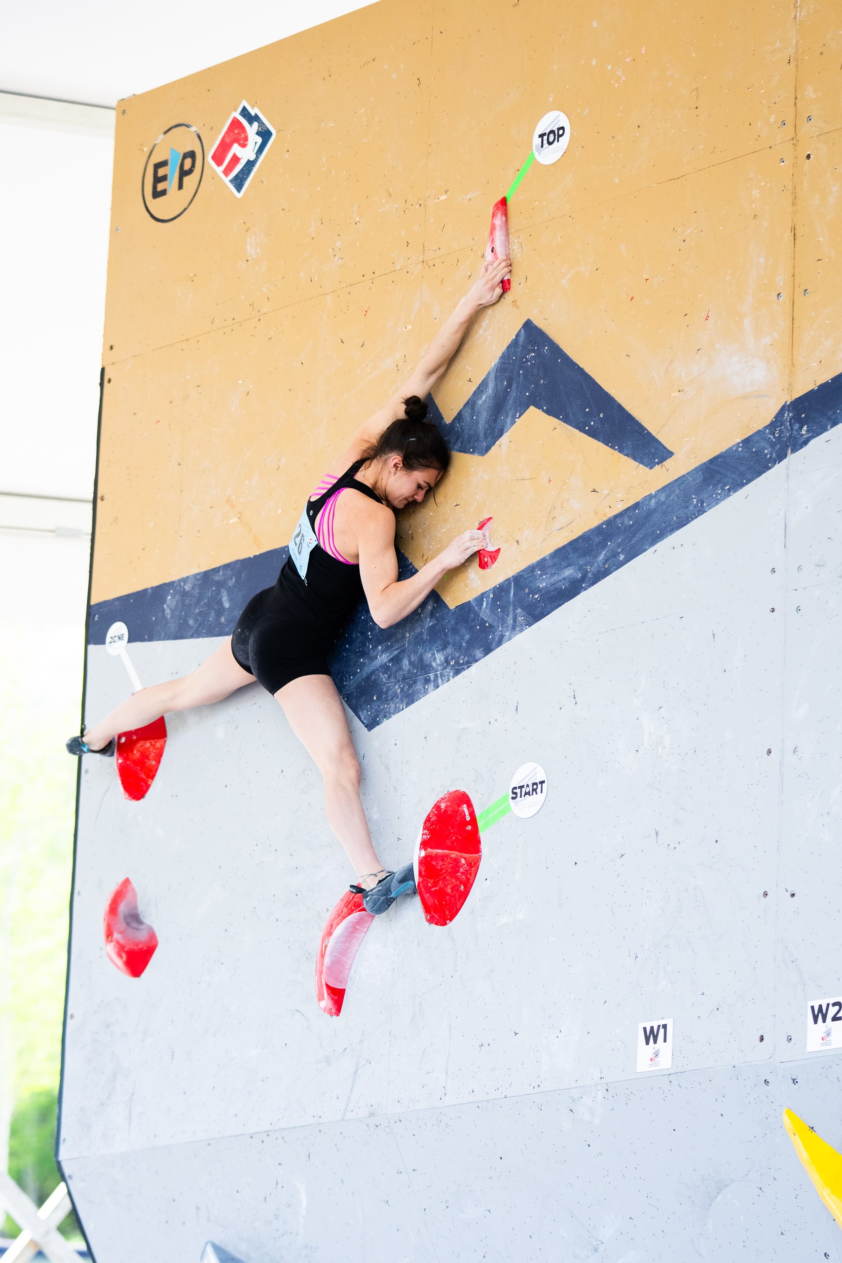 Woman competes in speed climbing at the 2024 NACS Vail.