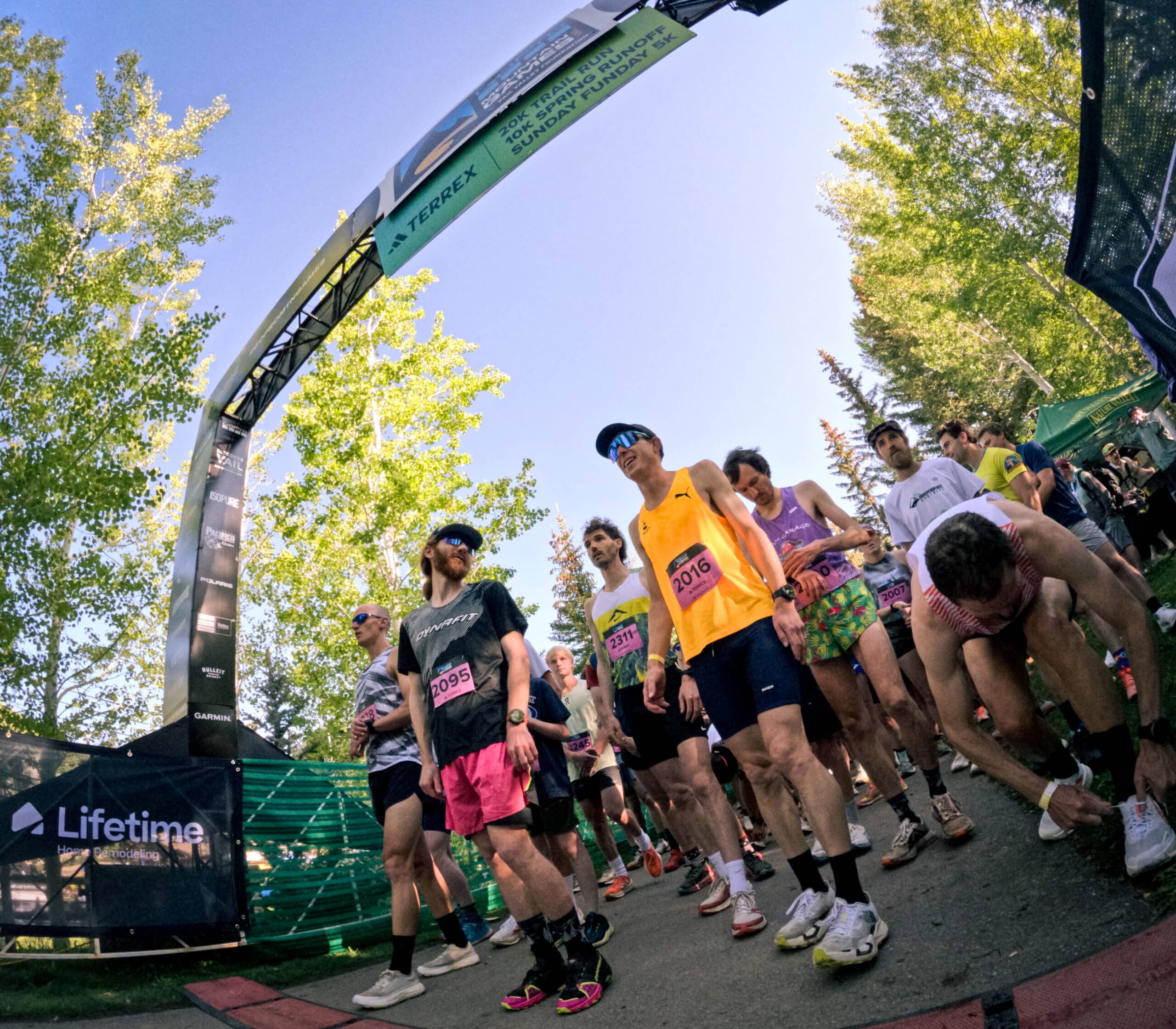 Cam Smith chats with fellow competitors at the 10K start line at the 2025 GoPro Mountain Games.