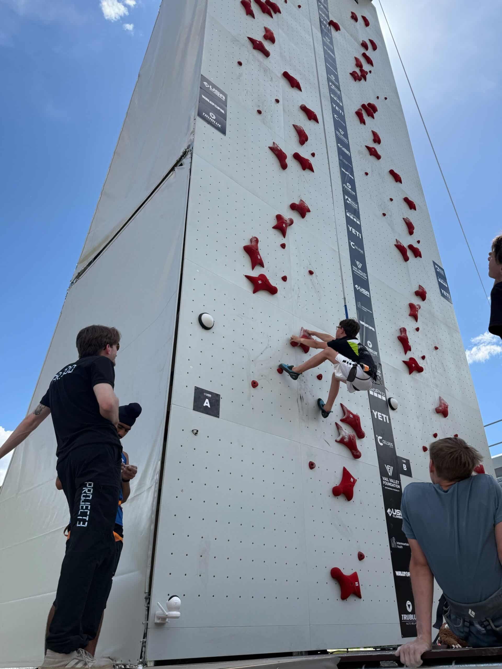 World Cup speed climber and coach Merritt Ernsberger watches as a Try Speed Climbing clinic participant goes up the speed wall.